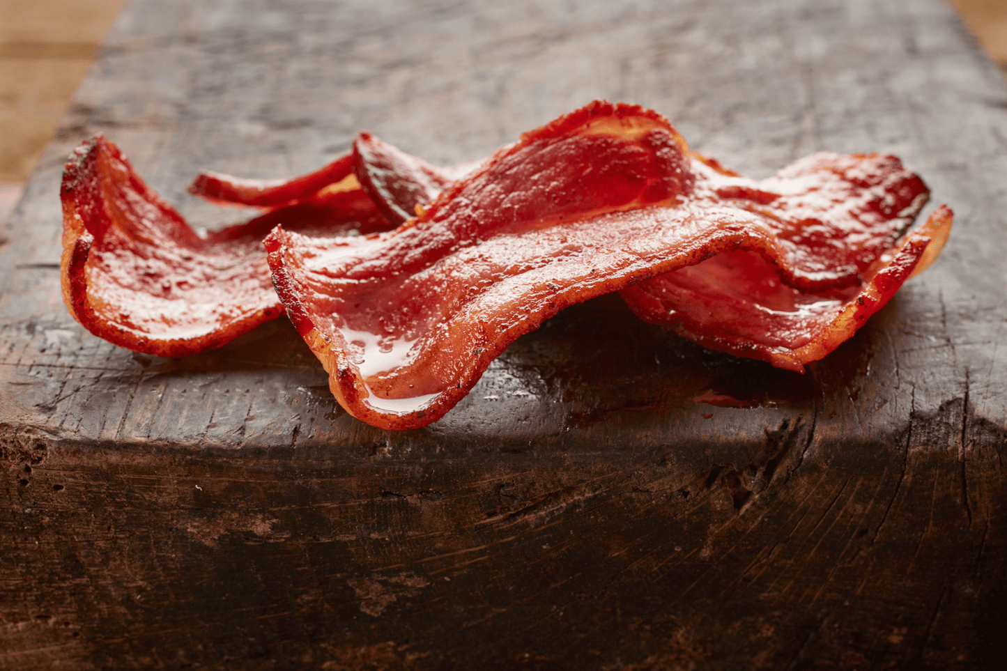 Two rashers of crispy streaky bacon.